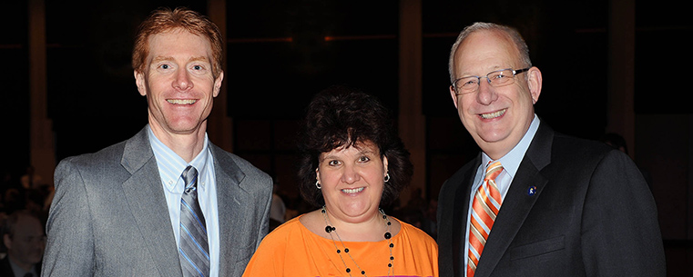 Kent City Manager Dave Ruller (left) with Lori Wemhoff, executive director of the Kent Area Chamber of Commerce, and Kent State University President Lester A. Lefton pose for a photo at the Spring 2013 Bowman Breakfast, where it was announced that Kent State University and the City of Kent have been selected as the winners of the Larry Abernathy Award.