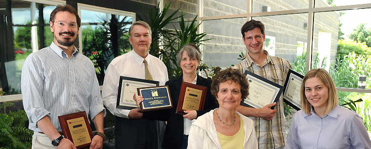 Staff members of WKSU-FM hold their Ohio Associated Press Broadcasters and Regional Edward R. Murrow awards. Pictured from left to right are Mark Urycki, Tim Rudell, M.L. Schultze, Vivian Goodman, Jeff St. Clair and Amanda Rabinowitz.