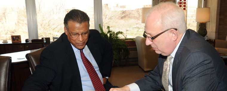 Kent State University President Lester A. Lefton (right) discusses Kent's downtown redevelopment plans with André Thornton (left), Kent State's first President's Ambassador.