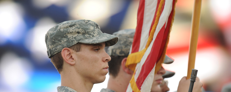 Members of the Army Reserve Officer Training Corps post the colors at a Kent State football game.