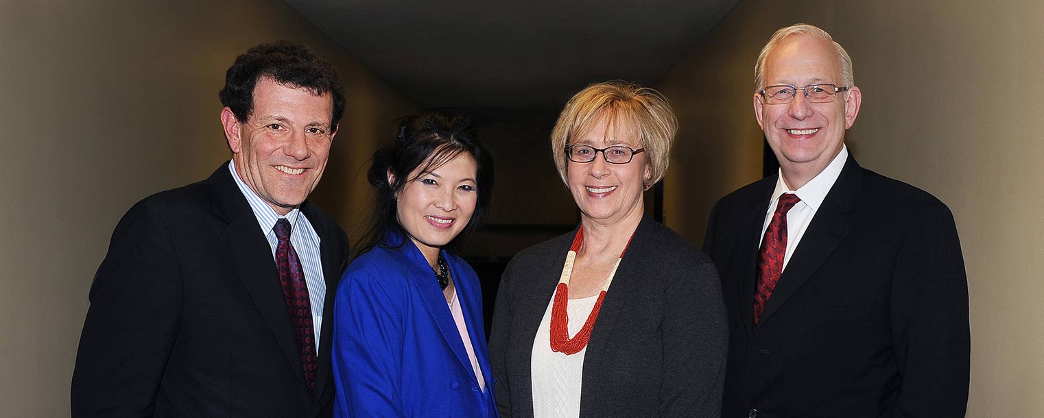 Pulitzer Prize-winning journalists Sheryl WuDunn and Nicholas Kristof pose for a photo with Kent State President Lester A. Lefton and his wife, Linda.