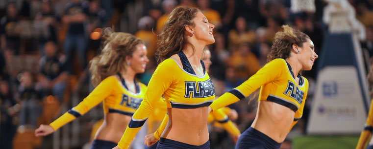 Members of the Kent State Dance Team hit the floor during a timeout in the Memorial Athletic and Convocation Center.