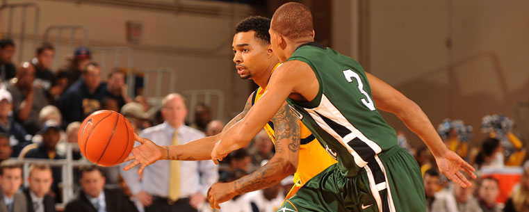 Guard Michael Porrini makes his way down the court during a game against Cleveland State.