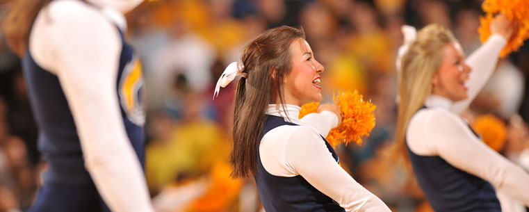 Kent State cheerleaders fire up a sold-out crowd at the Memorial Athletic and Convocation Center during a game against Cleveland State.