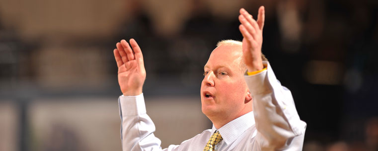 Kent State Golden Flashes head coach Rob Senderoff, in his first year as head coach, gestures to his team during a game against Cleveland State.