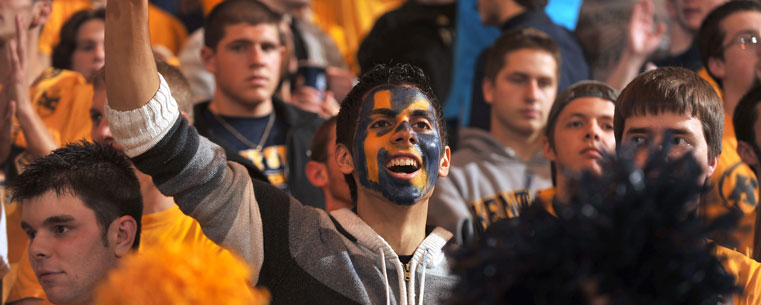 Fans of the Kent State Golden Flashes cheer on the team during a game against Cleveland State.