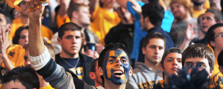 Fans of the Kent State Golden Flashes cheer on the team during a game against Cleveland State University.