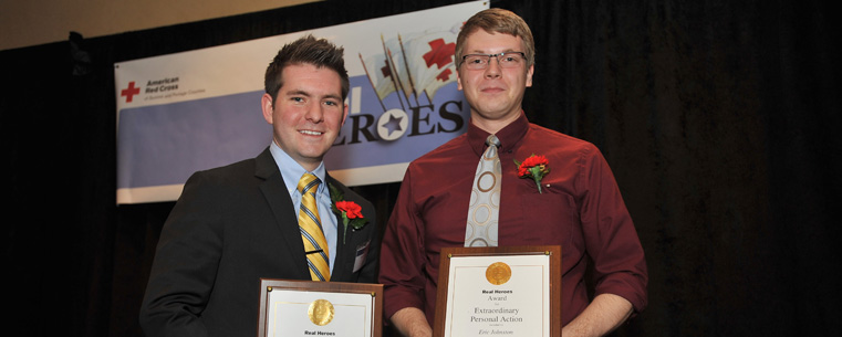 Kent State University graduate Jared Atkins and Kent State student Eric Johnston pose with their Real Heroes Awards after their presentation at the Bertram Inn in Aurora.