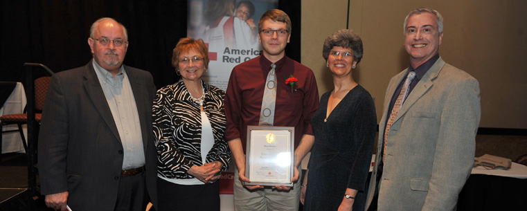 Kent State student Eric Johnston poses with members of Kent State’s School of Music and the College of the Arts who were on hand to see him receive his Real Heroes Award from the American Red Cross of Summit and Portage Counties.