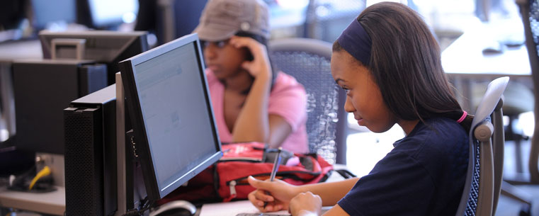 A Kent State student uses one of the 250 computer work stations in the Math Emporium.