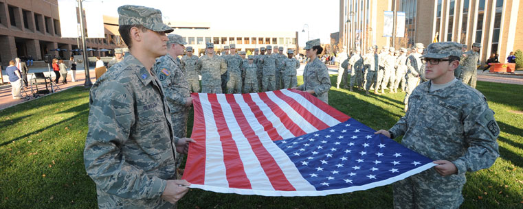 Members of the Kent State University Army Reserve Officer Training Corps (ROTC) prepare to fold the flag during the campus’ observance of Veterans Day.