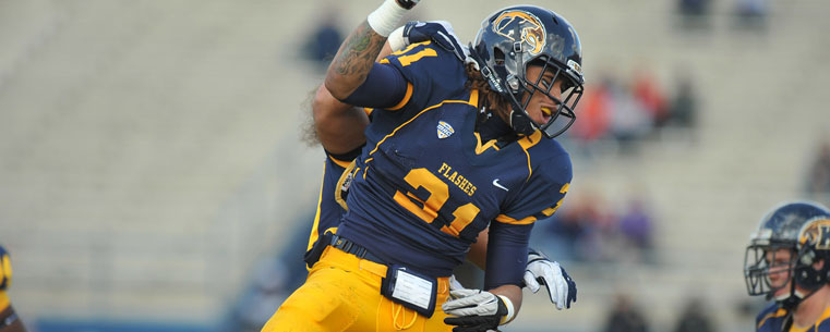 Devante Strickland celebrates a quarterback sack with a teammate during Kent State's win over Bowling Green Saturday.<br />