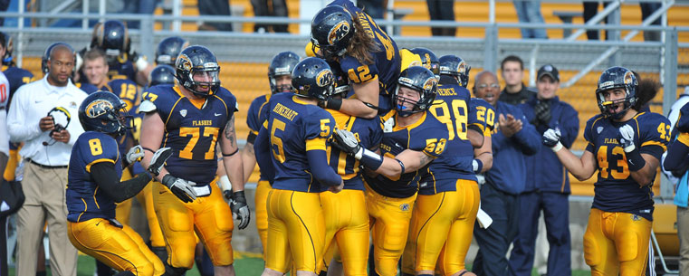 Members of the Golden Flashes celebrate a touchdown during their win against Bowling Green Saturday.