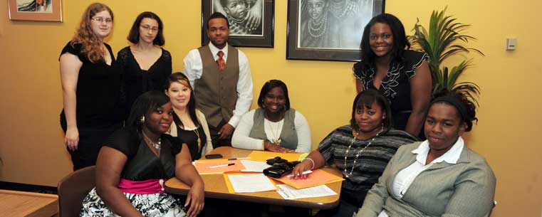 Graduates of Kent State's Upward Bound program pose with Bruce Mitchell, director of retention for the program.