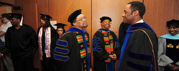 Fran Dorsey, associate professor of Pan-African Studies at Kent State, speaks with Dr. Kent Smith, vice president for Student Affairs at Ohio University prior to the start of the Upward Bound event.