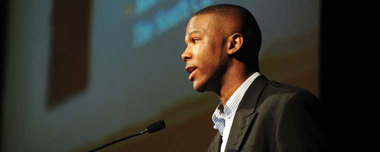 A graduating student from Kent State's Upward Bound program speaks to the crowd during the Senior Recognition Luncheon.