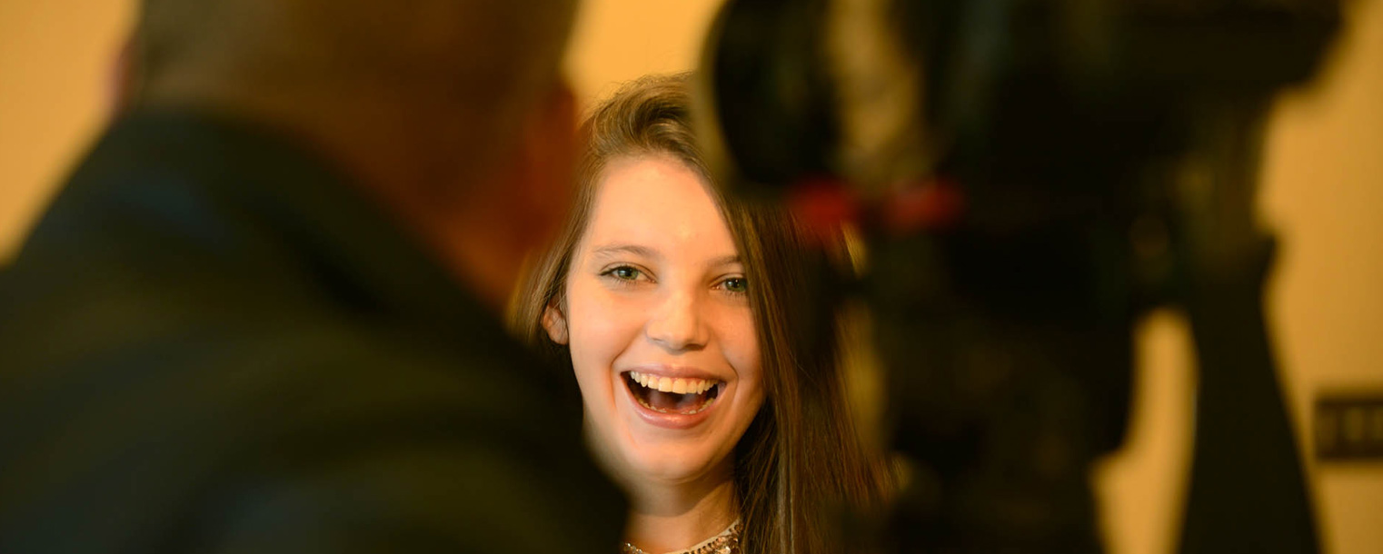 Kent State student Zoë Burch is interviewed by local media outlets after being recognized by the university and Ohio Homeland Security.