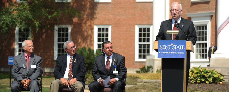 Dr. Lester A. Lefton speaks during the ribbon-tying event joining the Ohio College of Podiatric Medicine with Kent State University.