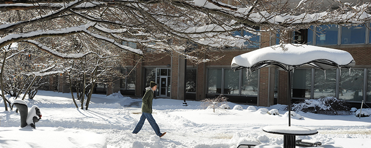 A Kent State student walks through the Murin Gardens by the library on his way to the Kent Student Center.