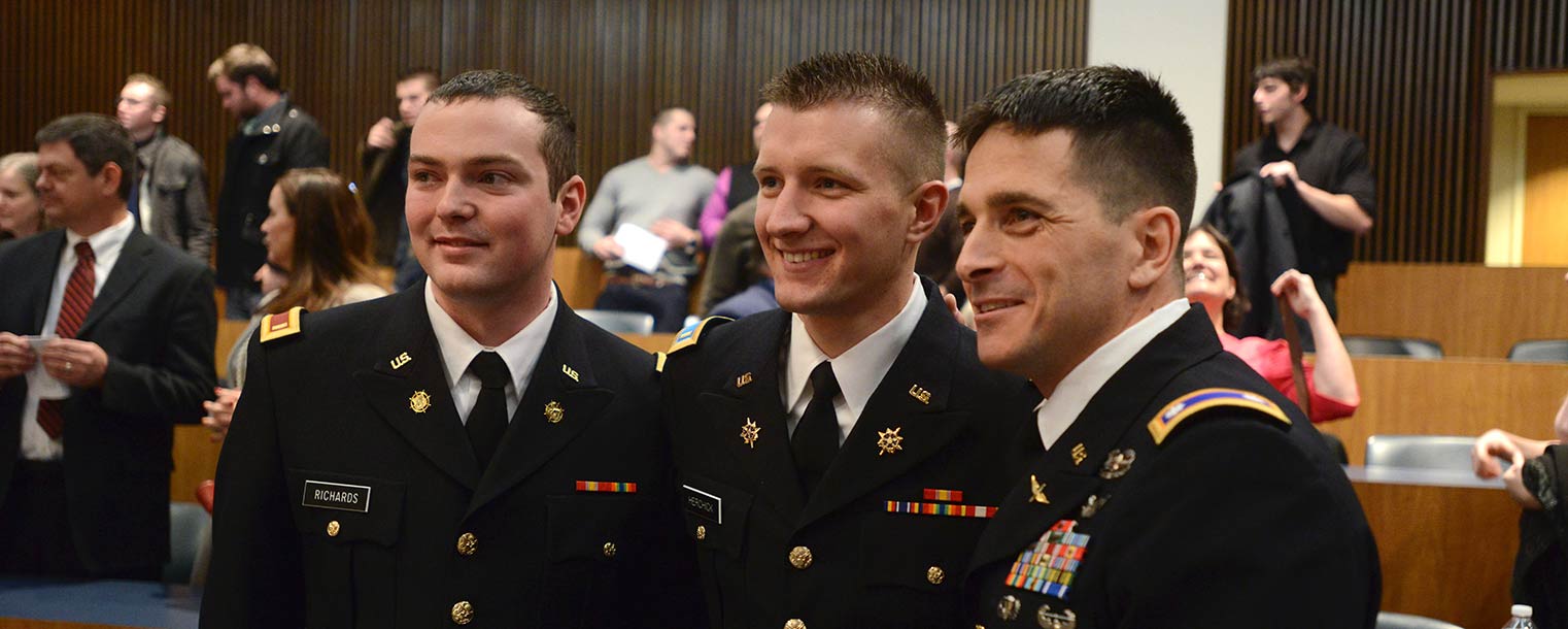 Newly commissioned U.S. Army 2nd Lts. John Richards (left) and David Herchick (center) pose with Lt. Col. Mark Piccone (right) after the commissioning ceremony.