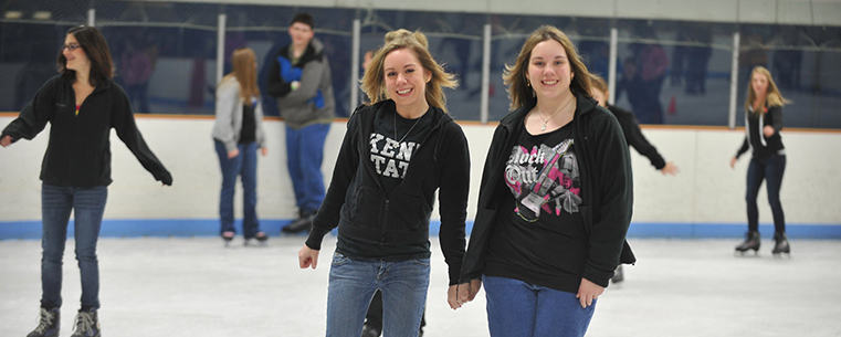 A Kent State student and her little sister skate at the university’s ice arena during Lil’ Sibs Weekend.