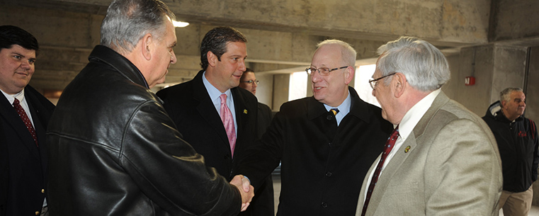 Kent State University President Lester A. Lefton greets U.S. Transportation Secretary Ray LaHood and Congressman Tim Ryan at the Kent Central Gateway multimodal transit center in downtown Kent.