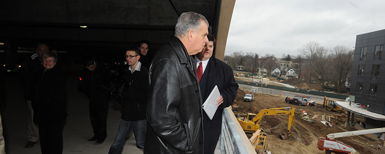 U.S. Transportation Secretary Ray LaHood looks out from the third floor of the new Kent Central Gateway multimodal transit center that is under construction in downtown Kent.