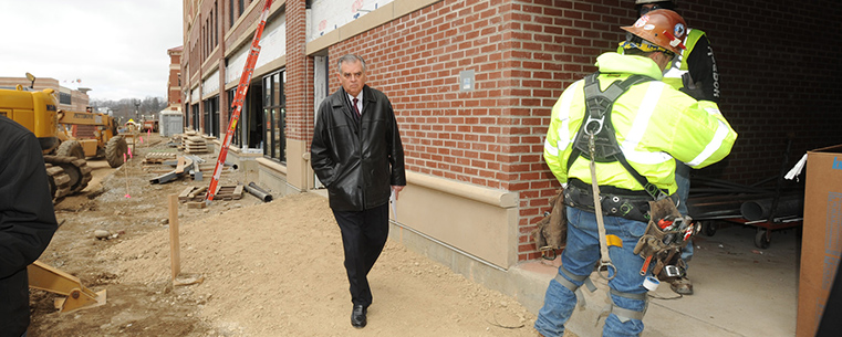 U.S. Transportation Secretary Ray LaHood walks beside the Kent Central Gateway multimodal transit center in downtown Kent.