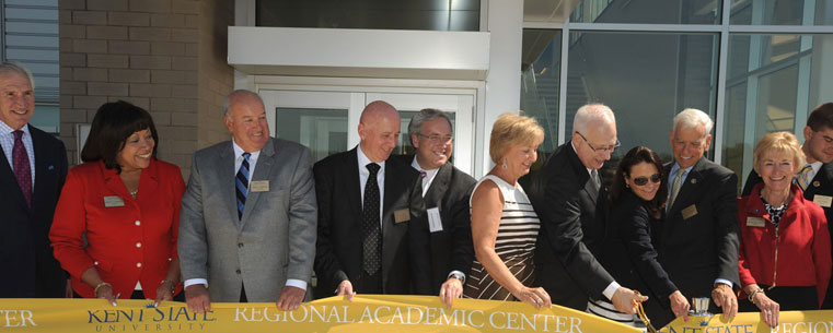 <p>Dr. Lester A. Lefton, Dean David Mohan and members of the Board of Trustees cut the ribbon on the Kent State University Regional Academic Center in Twinsburg.</p>