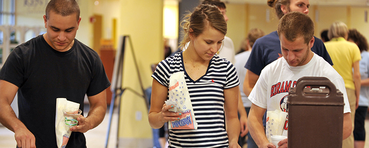 Kent State students are served popcorn, punch and coffee during the Stress-Free Zone event in the library.