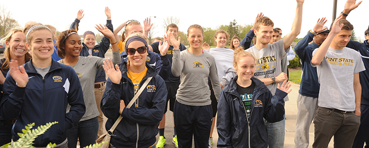 A group of student-athletes waves to the crowd during the groundbreaking for Kent State’s Field House Locker Room project. The Field House locker room will provide a new facility for soccer, softball, field hockey, men’s and women’s track and cross country.