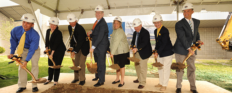 The first shovels of dirt are turned over during the groundbreaking for Kent State’s Field House Locker Room project.