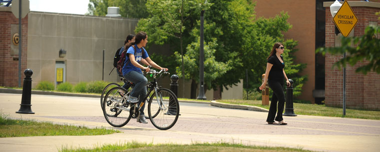 Kent State University students walk and bike to class along the University Esplanade.