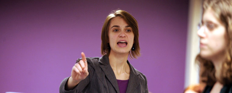 Molly MacLagan, a theatre studies major who graduated this spring, directs actors during a rehearsal in Johnson Hall.