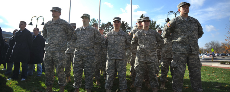 <p>Members of Kent State University's ROTC programs stand at attention during the 2011 Veterans Day service held on Risman Plaza.</p>