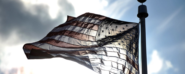 <p>The U.S. flag flies at full staff during Kent State's 2011 Veterans Day observance.</p>