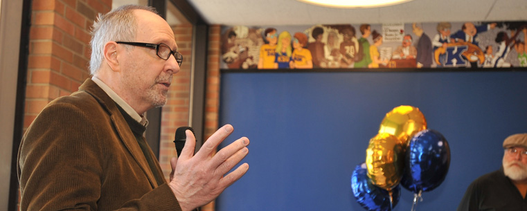 <p>Comic strip artist Tom Batiuk speaks during the grand opening of The Nest in the Kent Student Center.</p>