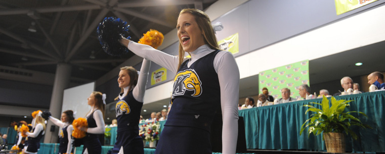 The Kent State cheerleaders entertain the crowd during the mayor's lunch at the Mobile Convention Center.
