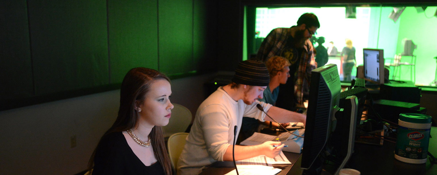 In a control room just outside the studio, a team of Kent State students direct and produce the newscast, working to keep everything running smoothly.