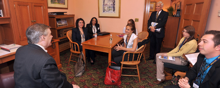 <p>Kent State students from the College of Business Administration, along with Trustee Richard Marsh (standing), meet with State Sen. Tom Sawyer in his office at the Ohio Statehouse.<br />
</p>