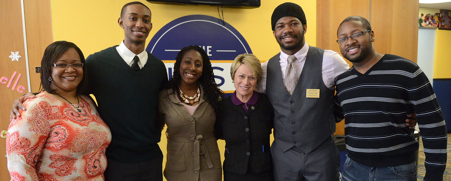 Kent State President Beverly Warren poses with students in The Nest in the Kent Student Center.