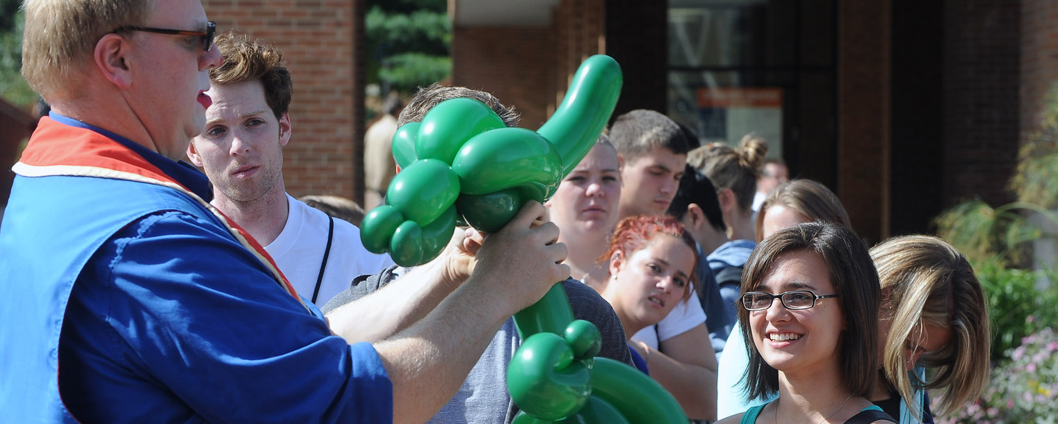 Kent State students form a line on Risman Plaza, waiting for balloon creations from a guest clown during the 32nd Annual Black Squirrel Festival.