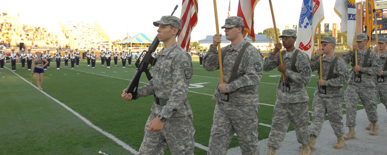 Members of the Kent State Army ROTC post the colors during a home football game.