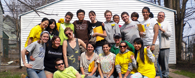 Kent State students gather in Buffalo outside of a Habitat for Humanity house rebuild in Buffalo, N.Y.