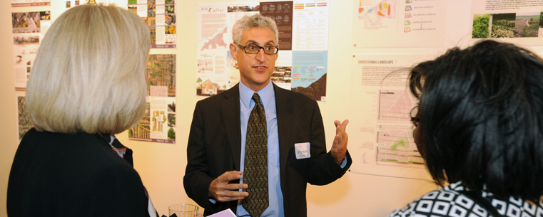 <p>Architecture and Environmental Design Professor Steven Rugare talks with guests attending Kent State's CUDC grand opening reception.</p>