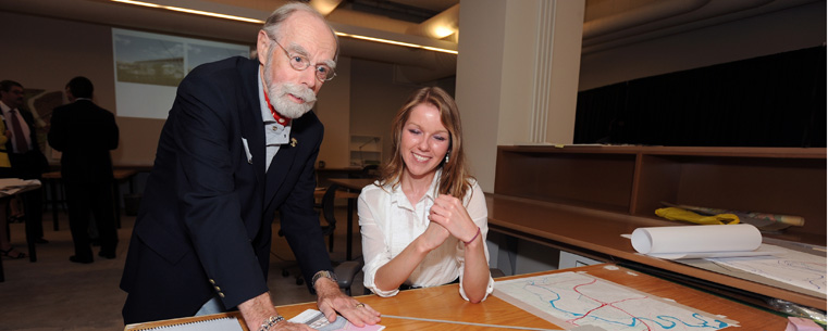 <p>Kent State benefactor Ron Teare reviews work of a Kent State architecture student at Kent State's Cleveland Urban Design Collaborative.</p>