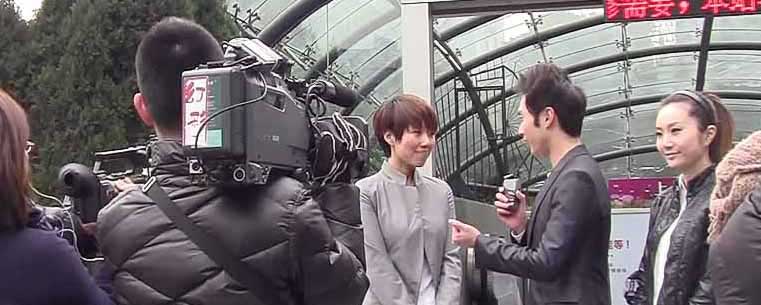 A television crew conducts an interview in Shanghai. Photo by Danielle Manfredi.