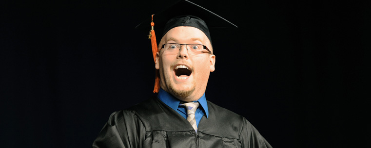 <p>A Kent State graduate reacts after receiving his diploma during morning commencement ceremonies in the Memorial Athletic and Convocation Center.<br />
<br />
</p>