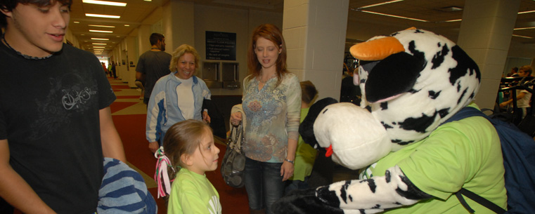 A child participating in the Lil Sibs Weekend last year picks out a prize being given out by one of the mascots at the event.