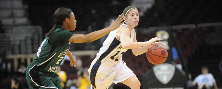 Flashes Guard Trisha Krewson looks for an opening during a MAC tournament game against Eastern Michigan.